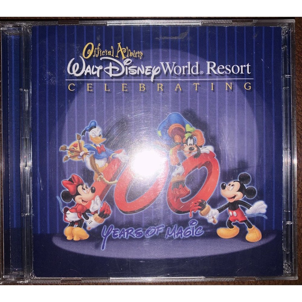 "WALT DISNEY WORLD RESORT OFFICIAL ALBUM"..."CELEBRATING 100 YEARS" Mint Discs